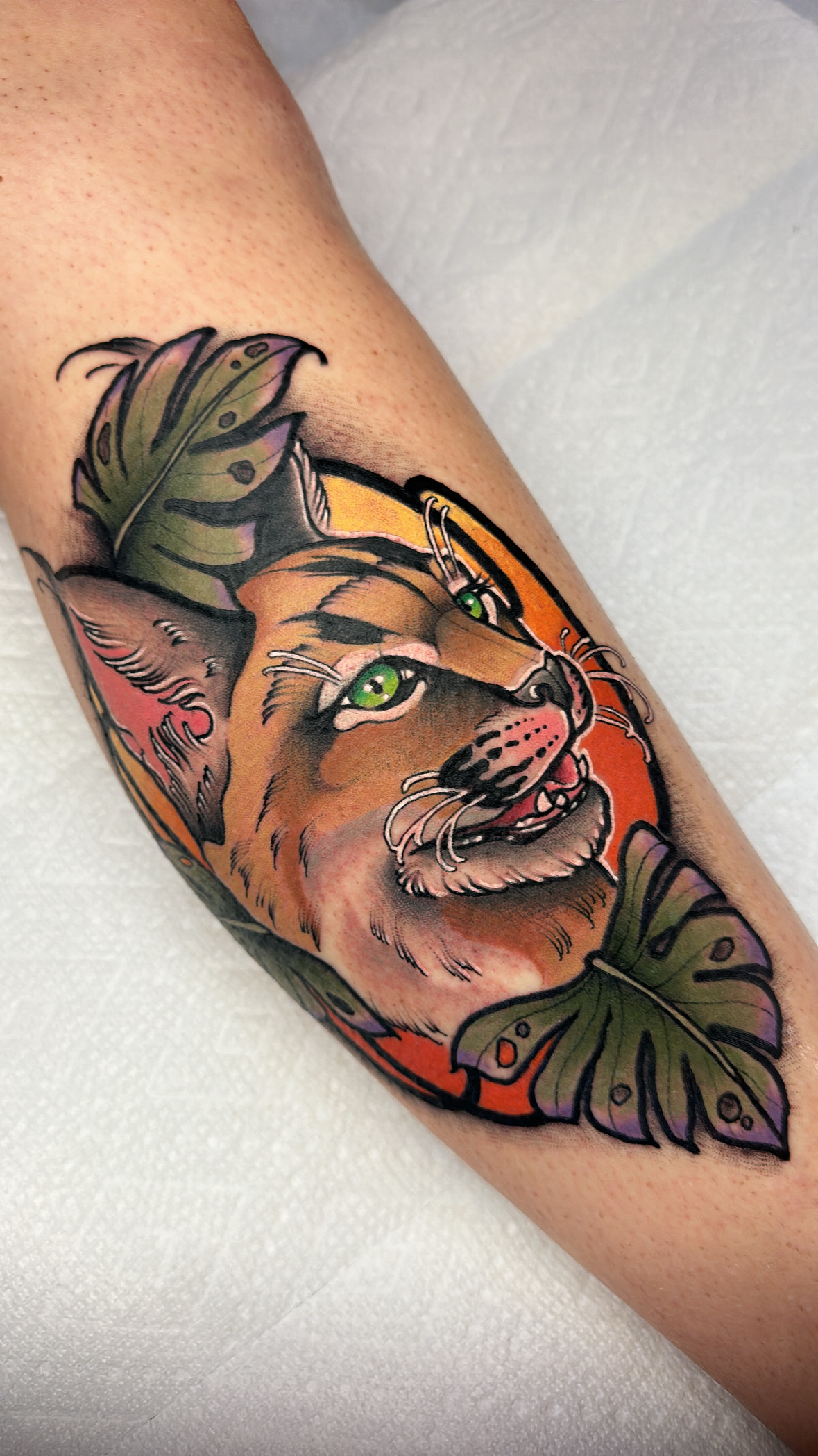Cougar with monstera leaves, neo traditional botanical tattoo by Mariella