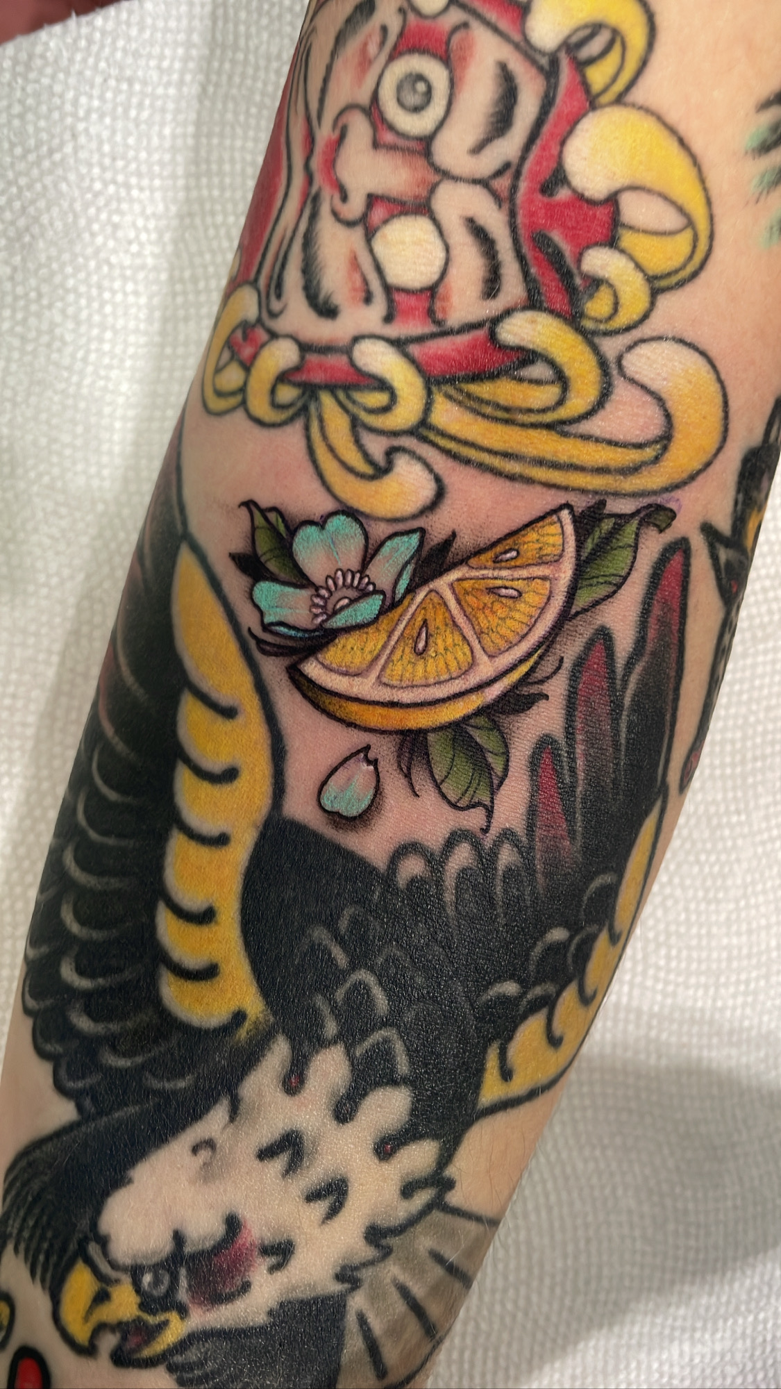 Eagle with lemon slice, neo traditional tattoo by Mariella