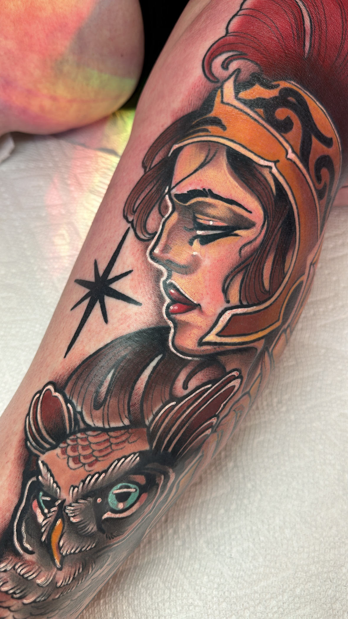 Athena with owl and shooting star, neo traditional leg tattoo by Mariella