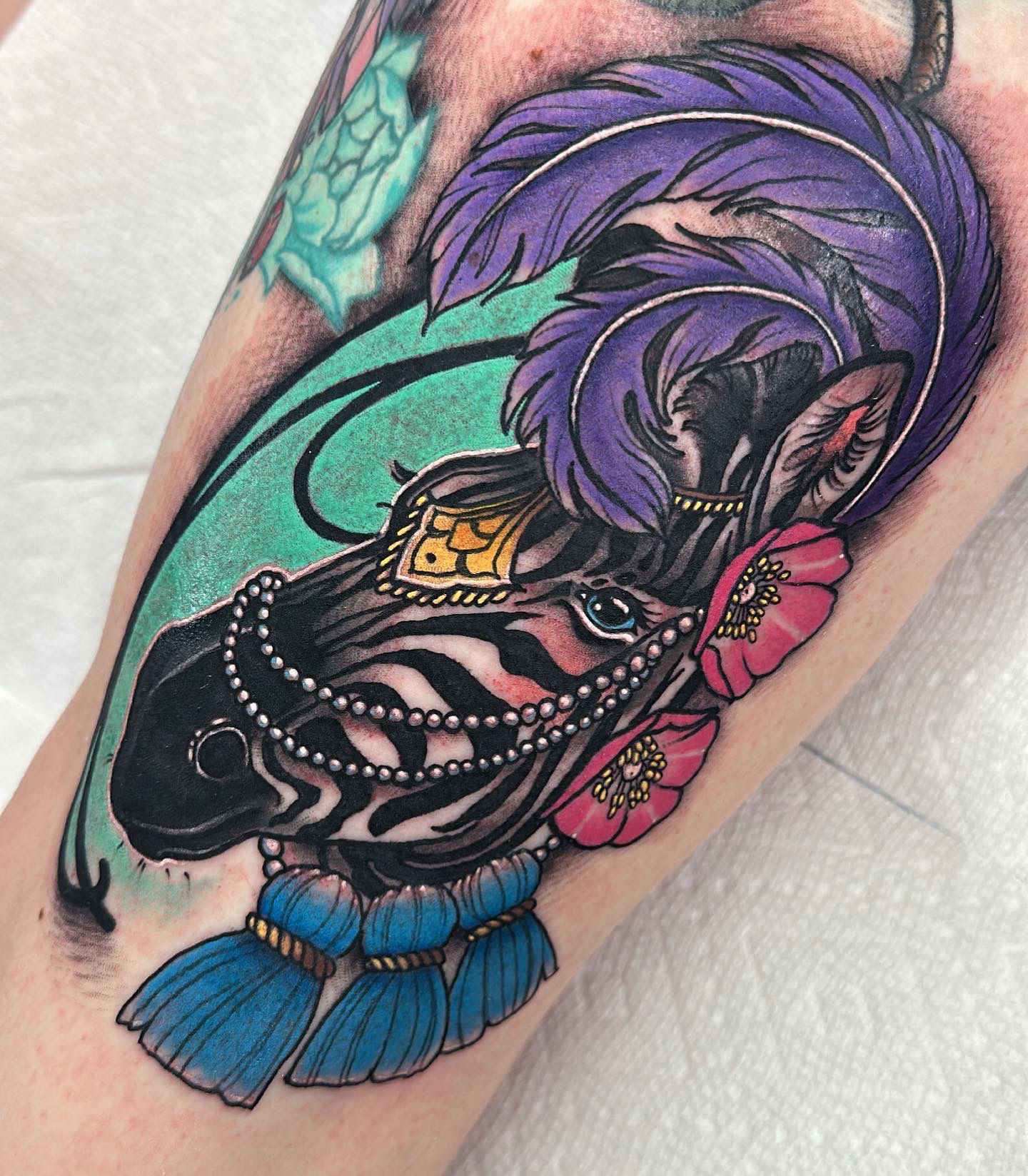 Zebra with feathers and flowers, neo traditional tattoo by Mariella